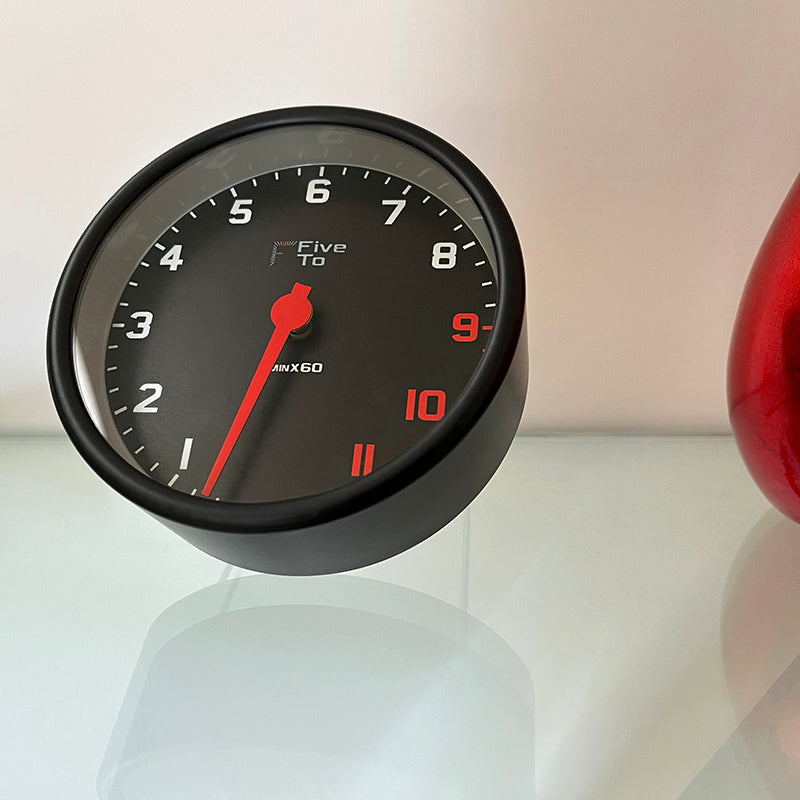 FiveTo Desktop Tacho Clock,Front right view. Timekeeping redesigned in the style of a sports car rev counter. Exclusively available from www.fiveto.co.uk