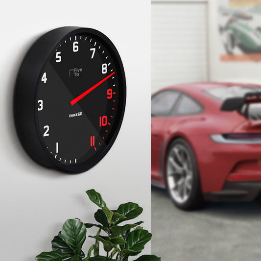 Porsche GT3 in garage with 14" Tacho Wall Clock, timekeeping redesigned in the style of a sports car rev counter. Only available from www.FiveTo.co.uk